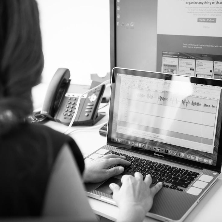 Mobile app project planning workspace with devices and development tools